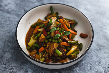 plant-based food,  vegan asian inspired stir fry with plant-based protein