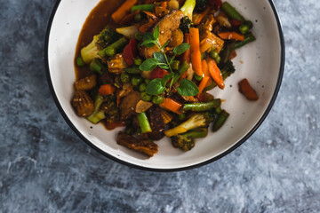 plant-based food,  vegan asian inspired stir fry with plant-based protein