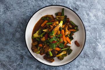 plant-based food,  vegan asian inspired stir fry with plant-based protein