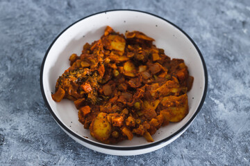 plant-based food, vegan garden vegetable roast with red pesto sauce