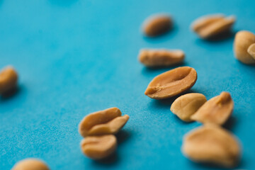 Fototapeta na wymiar Macro close up portrait of organic peeled peanuts , studio lighting, selective focus