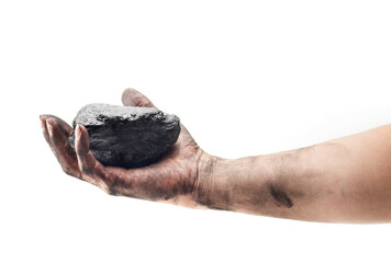 Obraz premium Pieces of coal in hand isolated on white background