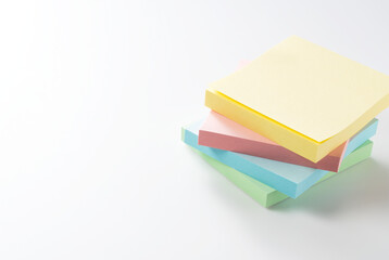 Four colorful sticky notes on a white background