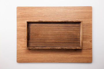 A square wood tray isolated white, top view at the studio.