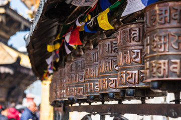 Fototapeta na wymiar Prayer wheels at Boudhanath Stupa in Kathmandu, Nepal