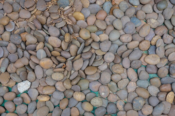 Pebble stone background, small Screen in garden with difference color, abstract background.