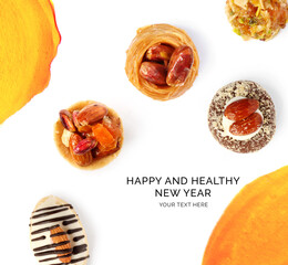 Creative happy and healthy new year card made of baklava on the white background. Desserts happy new year, top view, festive greeting card.