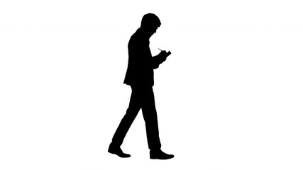 Silhouette Businessman walking and writing down his ideas.