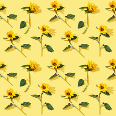 Seamless regular pattern from blooming yellow flowers sunflower on paper background.