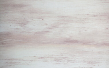 Light wood with voluminous blotches of pink, close-up polished surface.