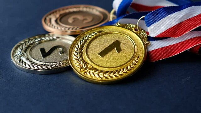 concept for winning or success. Gold medal, silver medal and bronze medal on yellow background. video stock footage