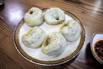 Asian dumplings in bow. Traditional Asian/Chinese cuisine.