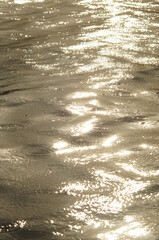 Background with a motif of fuzzy and rough water surface during the rain 