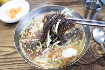 Delicious korean style cold noodles In a bowl.
