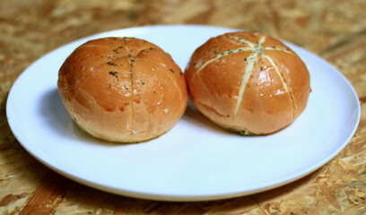 Korean garlic cheese bread on wood background.