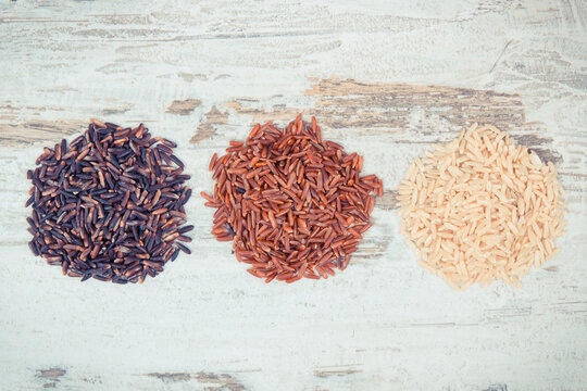 Vintage photo, Heap of brown, black and red rice, healthy gluten free food concept