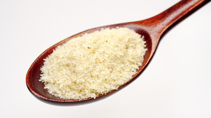 Close up of psyllium (ispaghula) husk in wooden spoon.Psyllium husk also called isabgol is fiber derived from the seeds of Plantago ovata plant found in India. Selective focus.	
