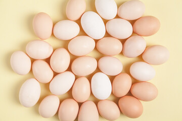 Eggs on yellow background. Food concept