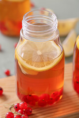 Bottle of fresh ice tea on table