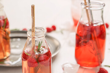 Bottles of fresh ice tea on table