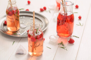 Bottles of fresh ice tea on table