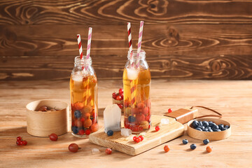 Bottles of fresh ice tea on table