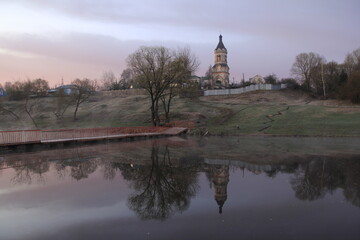 Russian orthodox church on the river in an early morning