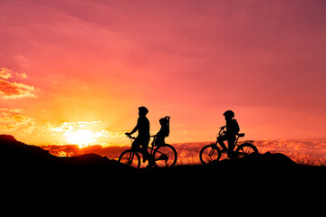 Fototapeta na wymiar father riding a bike with family members