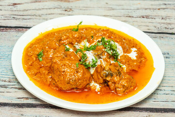 chicken kasha is a very popular Bengali dish. It is cooked in onion, ginger-garlic, and masala based gravy. The dish is semi-dry.