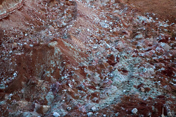 textures of various clay layers underground in  clay quarry after  geological study of  soil. colored layers of clay and stone in  section of  earth, different rock formations and soil layers.
