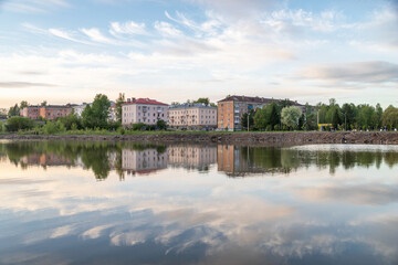 Reflection of houses in the pond in the evening