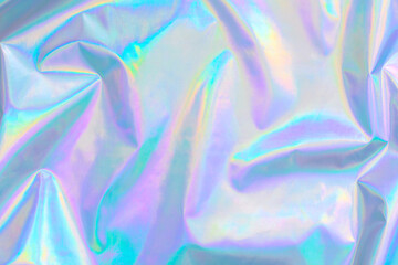 Abstract Modern pastel colored holographic background in 80s style. Crumpled iridescent foil...