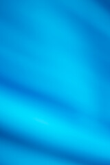 Soft texture blue curtains with abstract wavy lines.