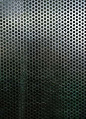 Perforated metallic grid, industrial background. Steel plate with holes