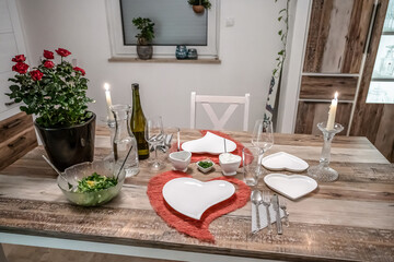 Valentines day dinner setting romantic love for two wooden table red heart shape candle light with roses