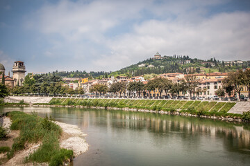 Fototapeta na wymiar Beautiful view of Verona and the Adige river from the Peter's bridge (Ponte Pietra). Verona, Veneto, Italy