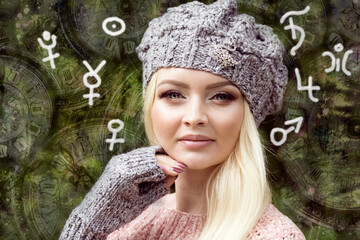 Woman surrounded by astrological symbols of the planets in the horoscope
