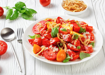 tomato salad with fried onion, quinoa and basil