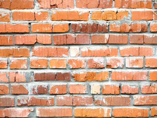 Obraz premium brick red wall of the barn for a brutal background in the loft