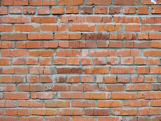 brick red wall of the barn for a brutal background in the loft