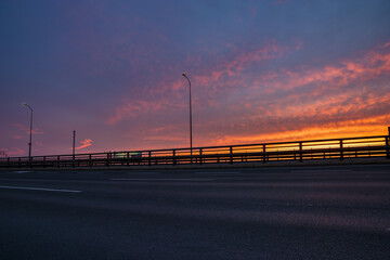 express road leading through the city during sunrise, perfect as a backplate for rendering e.g. cars