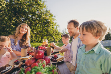 Portrait of nice attractive adorable adopted foster cheerful family mom dad brother sister gathering traveling spending free time sunny day on fresh air eating lunch house domestic party