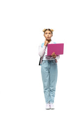 Pensive girl with backpack holding laptop on white background