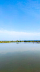 Fishing lake in the foggy morning