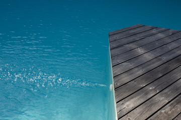 Empty wooden terrace background of swimming pool
