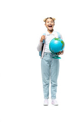 Excited schoolchild with globe and backpack looking at camera on white background