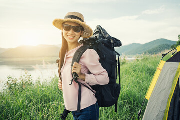 Beautiful Asia woman traveler smile and look at camera, mountain travel concept.