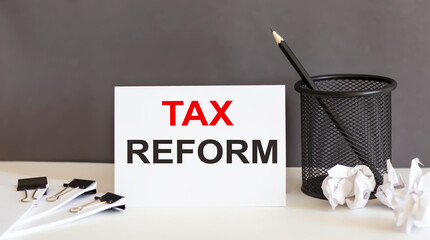 TAX REFORM text and office supplies, business concept