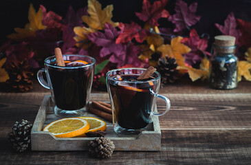 Cozy autumn drink. Hot mulled wine with oranges and spices.