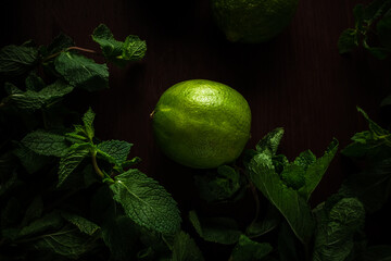 mint and lime on a wooden table